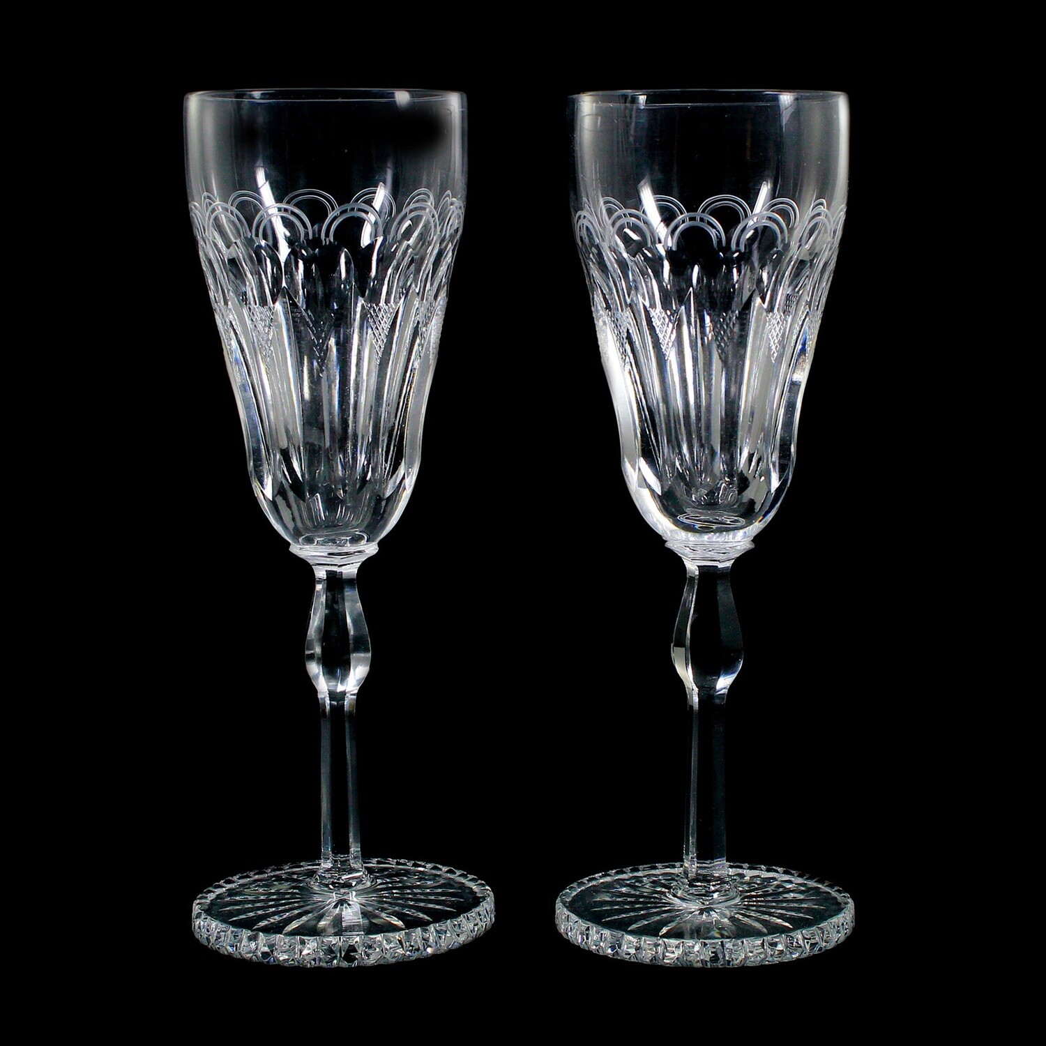 2 champagne glasses made of cut-decorated lead crystal with a solid base plate, around 1930-40