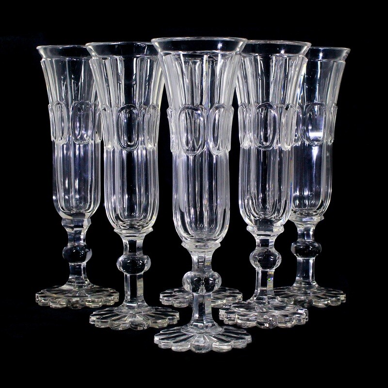 6 Biedermeier champagne flutes made of colorless glass with a highly cut oval medallion