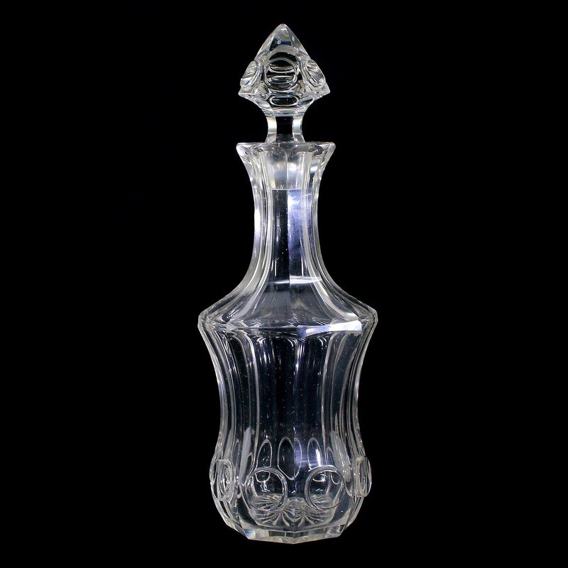 Pair of carafes with stoppers made of colorless glass with a highly cut round medallion.