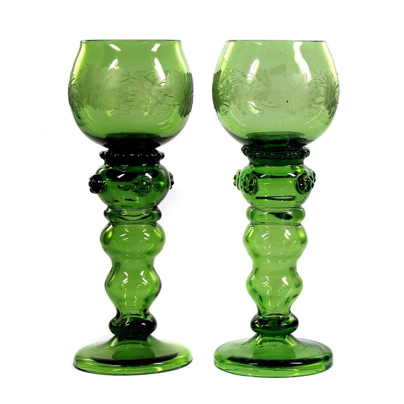 Pair of Theresienthaler Romans with an articulated shaft made of dark green crystal glass around 1890.