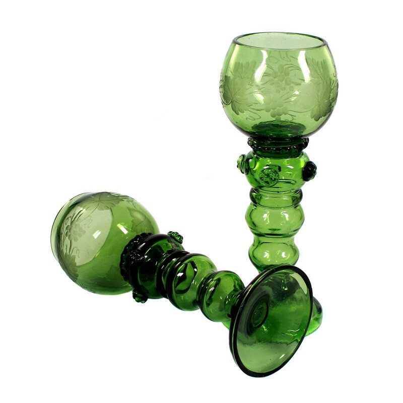 Pair of Theresienthaler Romans with an articulated shaft made of dark green crystal glass around 1890.