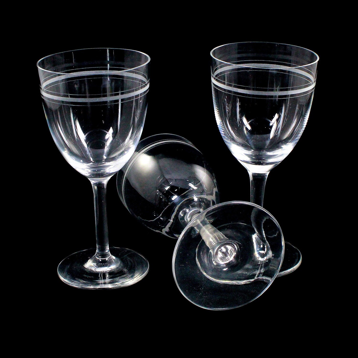 3 stem glasses made of colorless glass with etched decorative band, around 1900-10