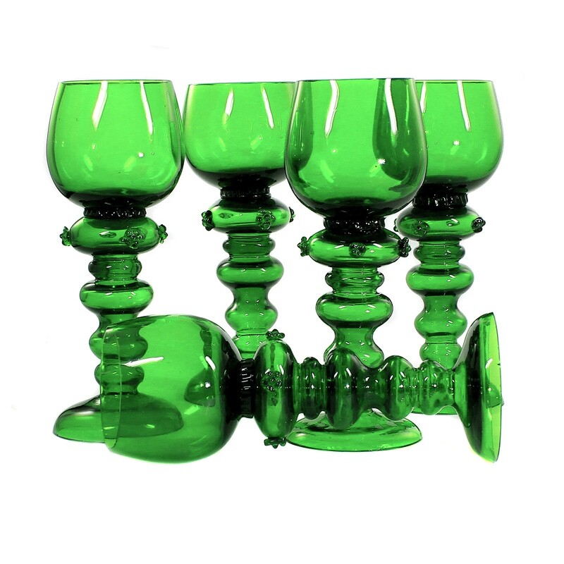 5 Romans with articulated shafts made of dark green glass, Bavarian Forest around 1900.