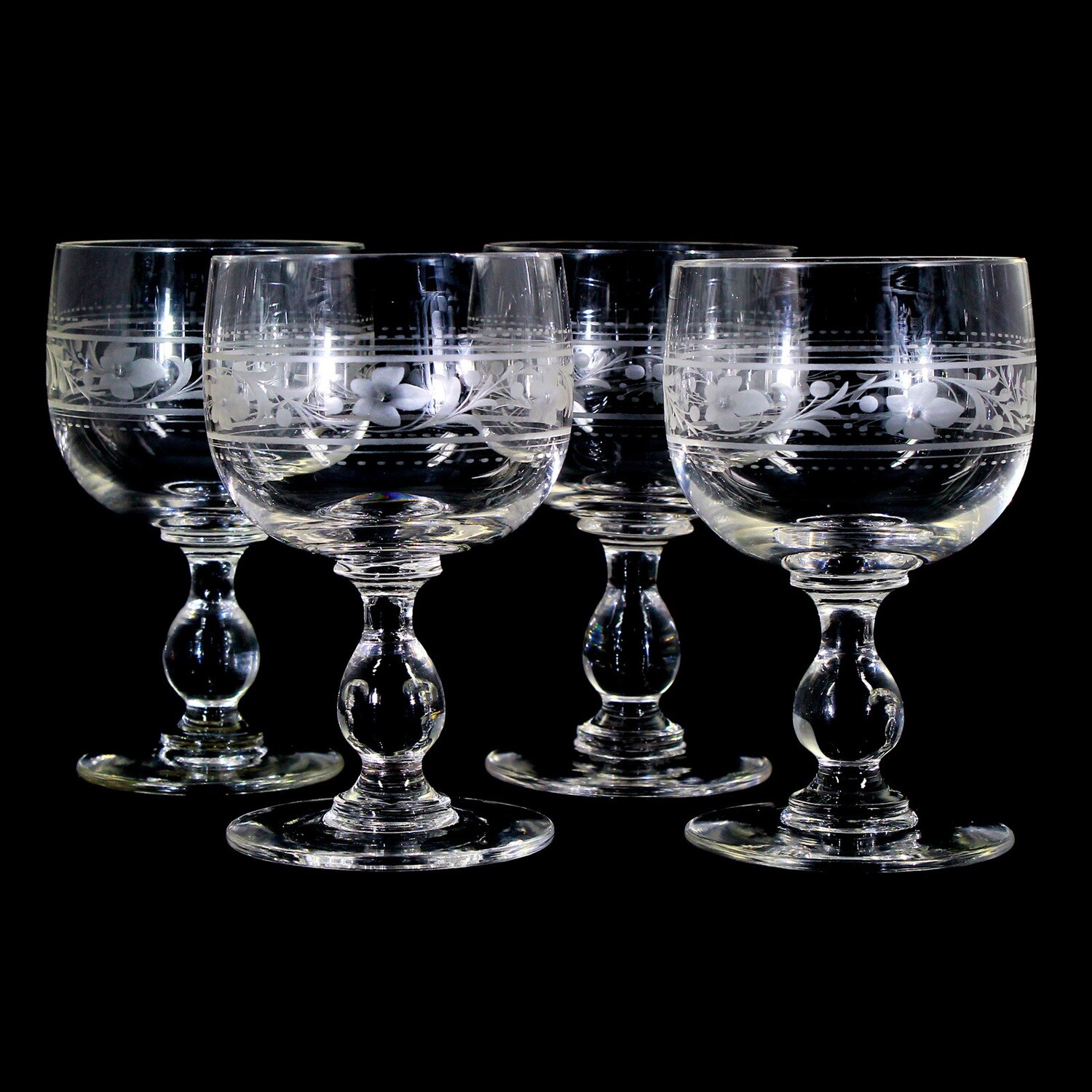 4 wine glasses made of colorless crystal glass with decorative cut decoration, around 1900.