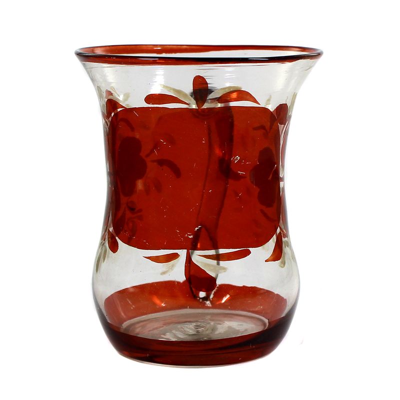 Red glazed handle mug made of colorless glass with a chipped tear-off