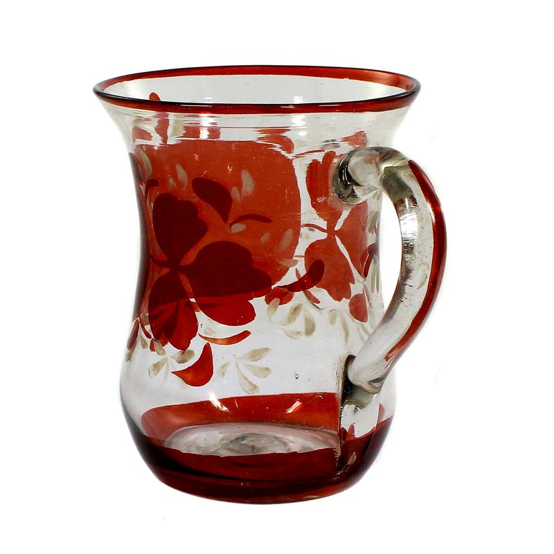 Red glazed handle mug made of colorless glass with a chipped tear-off