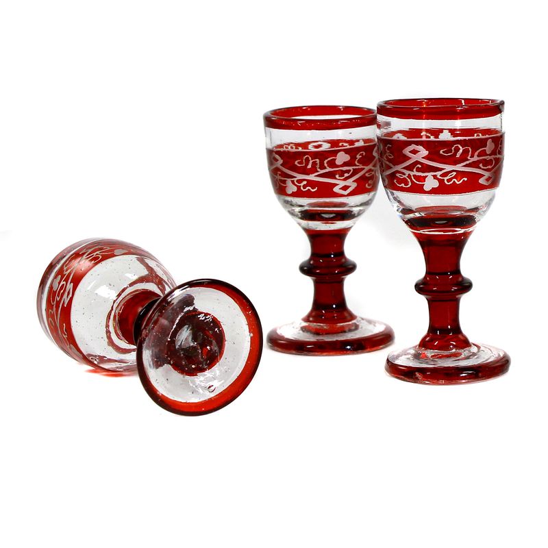 3 liqueur glasses with tear-off, ruby ​​red glazed, with decorative cut decoration, Bohemia, 19th century.