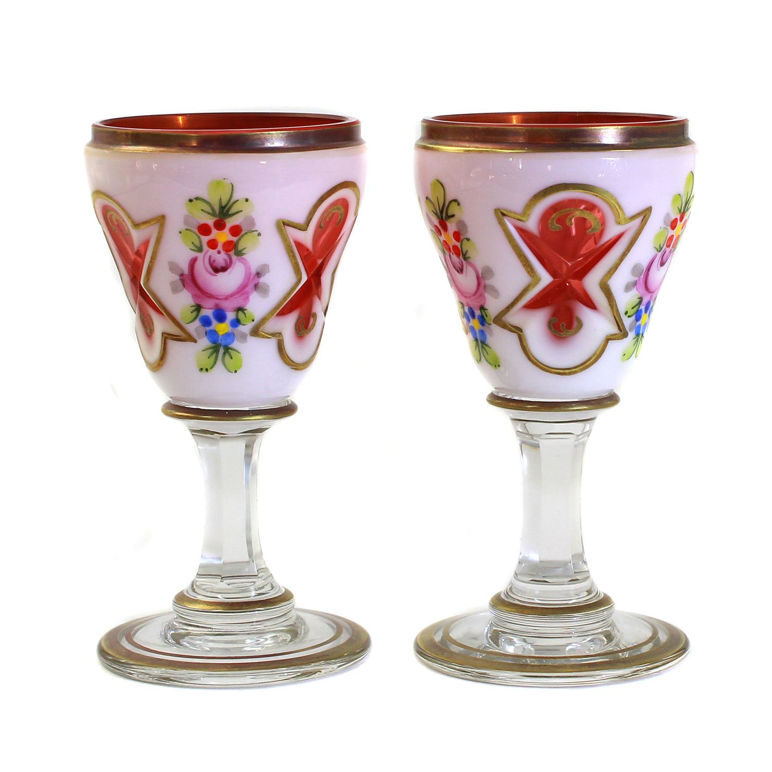 2 shot glasses with tin enamel overlay and red inner rim, Bohemia around 1930