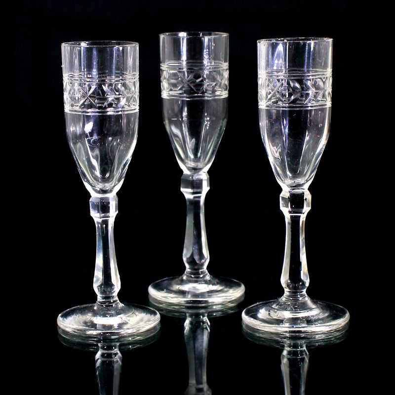 3 vodka glasses made of colorless glass with decorative cut decoration, Russia, end of the 19th century.