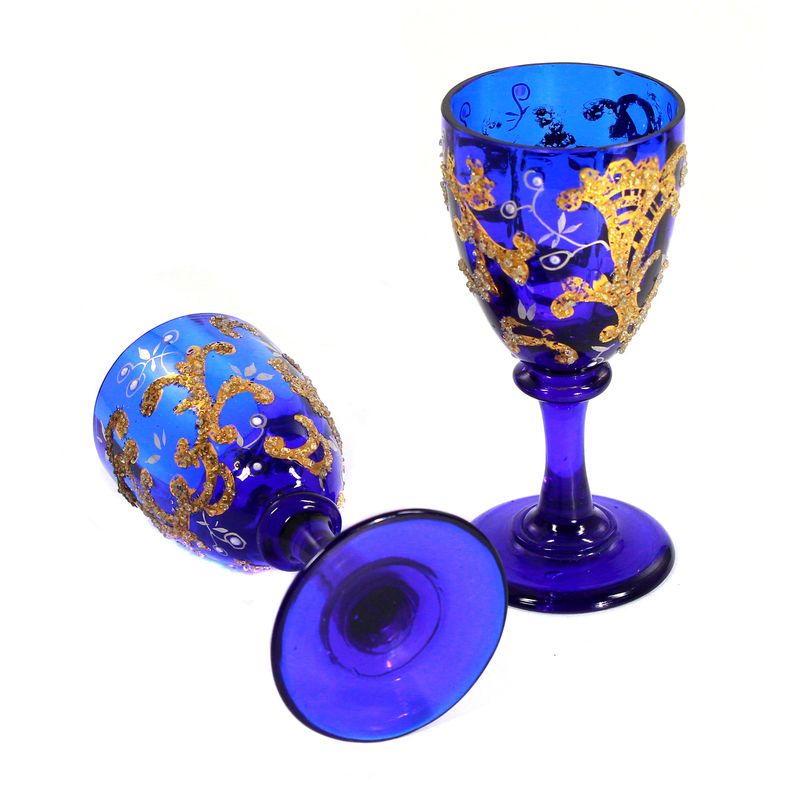 Pair of stemmed glasses made of cobalt blue glass with silver and gold painting, Russia
