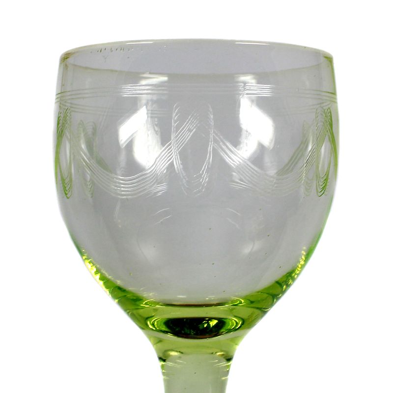 Stem glass made of uranium-containing glass with guilloche-cut scalloped border, around 1910