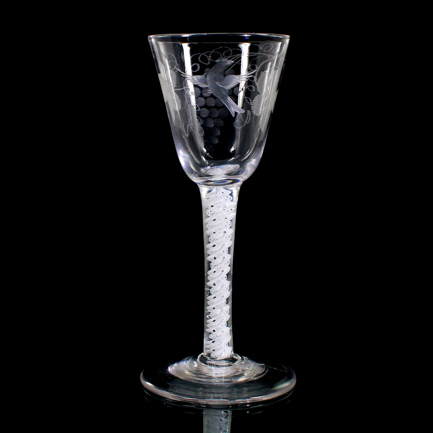 Engraved wine glass with opaque white thread decoration, England around 1760.