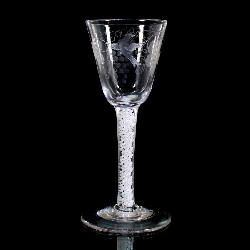 Engraved wine glass with opaque white thread decoration, England around 1760.