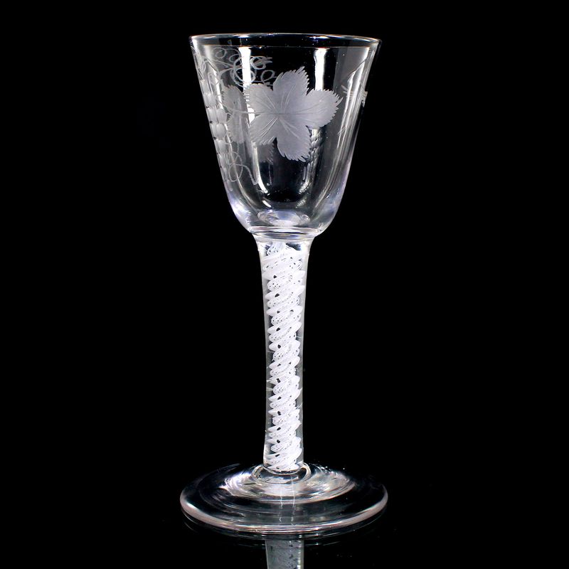 Engraved wine glass with opaque white thread decoration, England around 1760.
