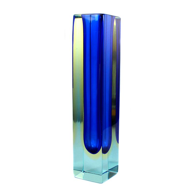 Block vase made of light blue glass with dark blue inner rim and yellow intermediate rim.