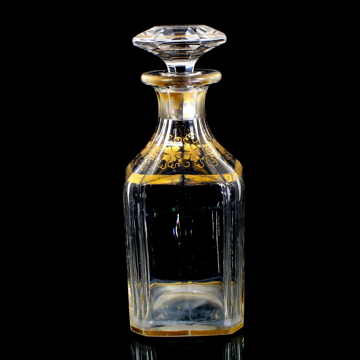Multi-faceted carafe with stopper and gold painting, France around 1870-80