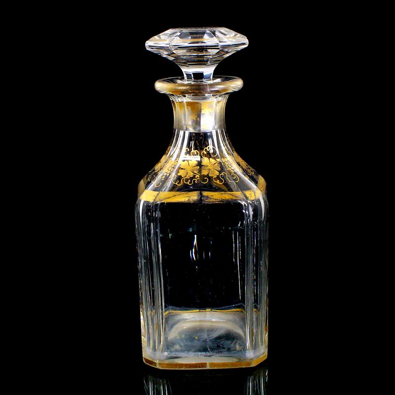 Multi-faceted carafe with stopper and gold painting, France around 1870-80