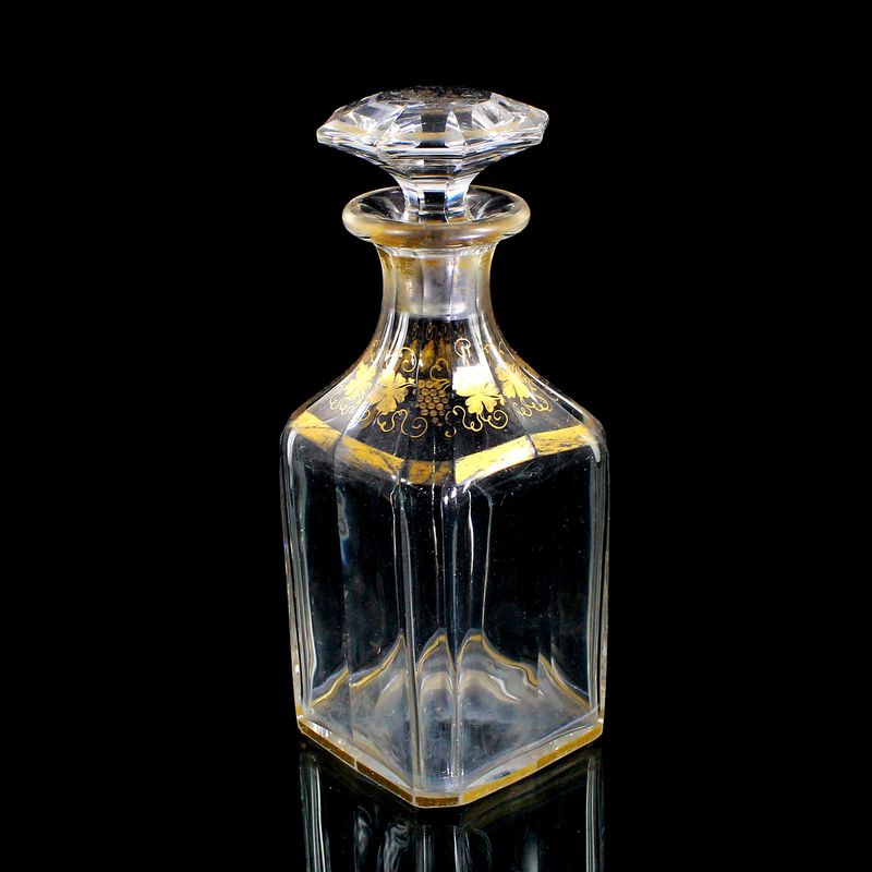 Multi-faceted carafe with stopper and gold painting, France around 1870-80
