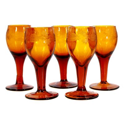 5 goblets made of amber-colored glass with decorative cut decoration, early 19th century. ​