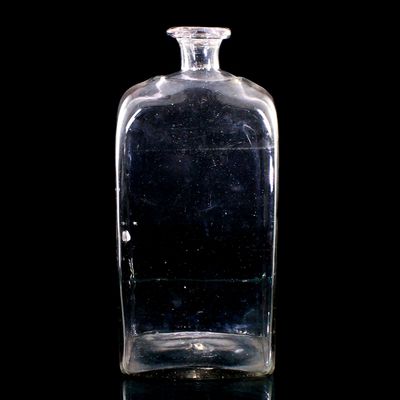 Tall rectangular bottle made of colorless glass, Europe, late 18th century.