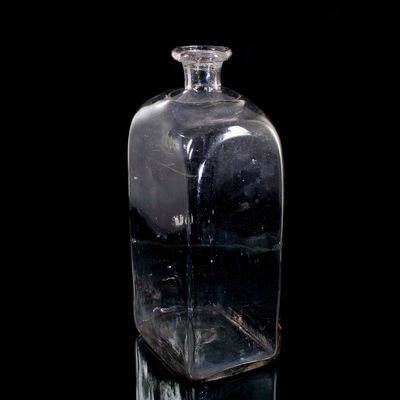 Tall rectangular bottle made of colorless glass, Europe, late 18th century.