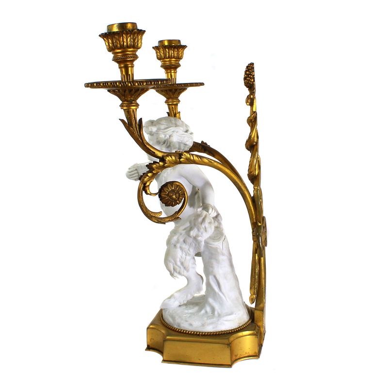 Bronze candlestick with Greek faun in biscuit porcelain, 2nd half of the 19th century.