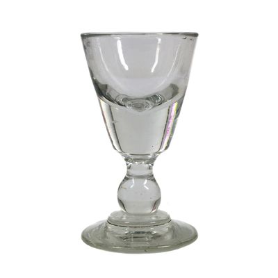 Massive shot glass, so-called &quot;cheater&quot; made of colorless glass, second half of the 19th century.