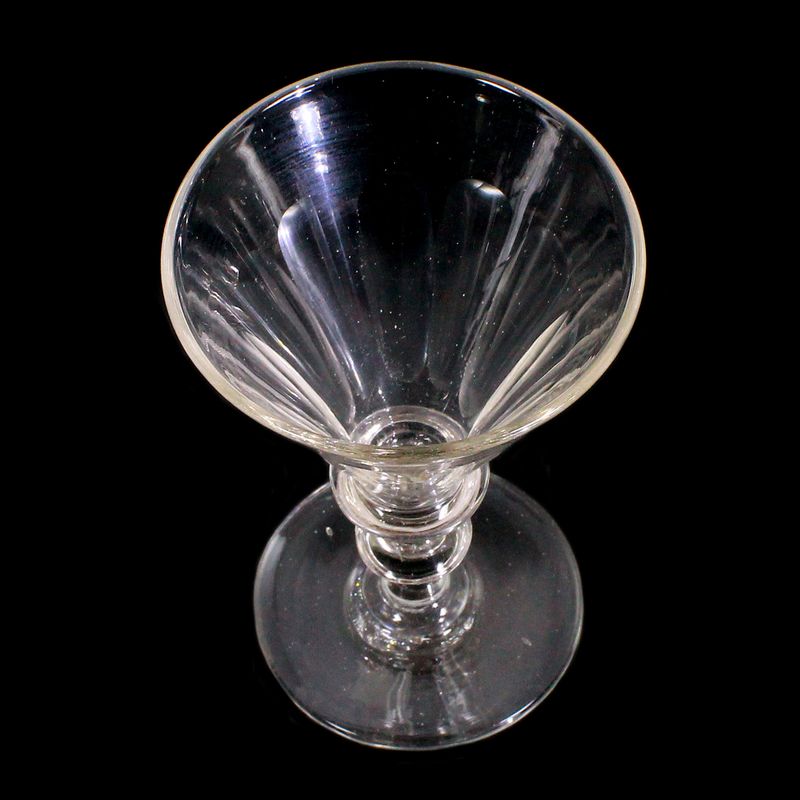 Goblet made of colorless glass with arched facets, pressed knop, mid-19th century.