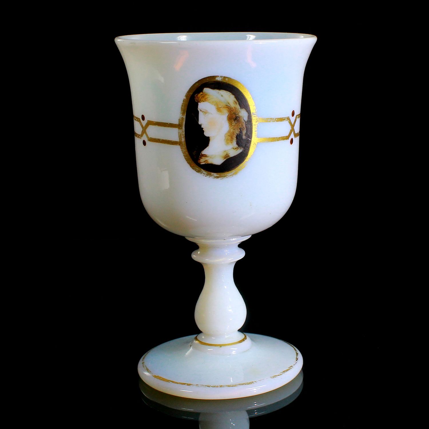 Cup made of opaque white glass with three antique-style portraits, second half of the 19th century.