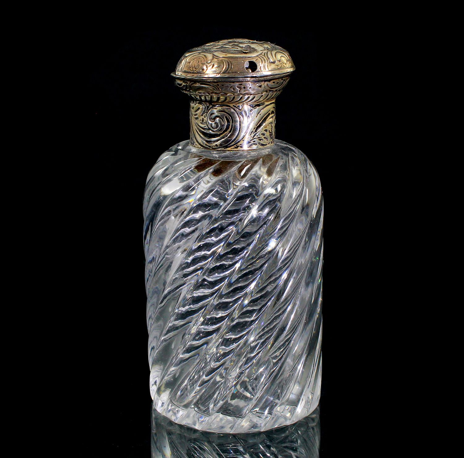 Bottle made of colorless crystal glass with silver mount, England circa 1880-90.