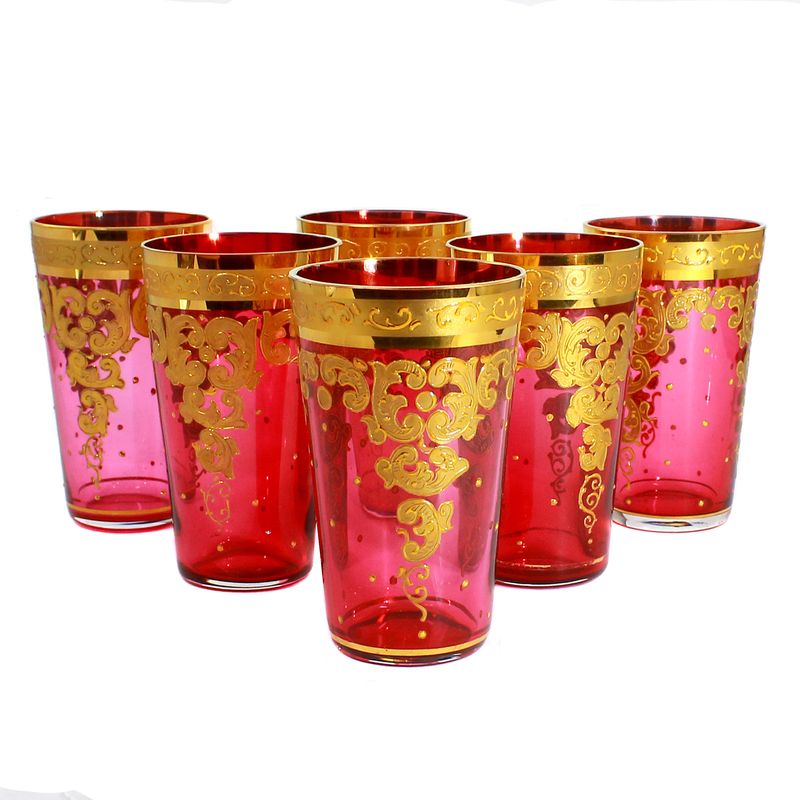 6 champagne glasses with rose-colored base and gold painting, probably Moser in Carlsbad.