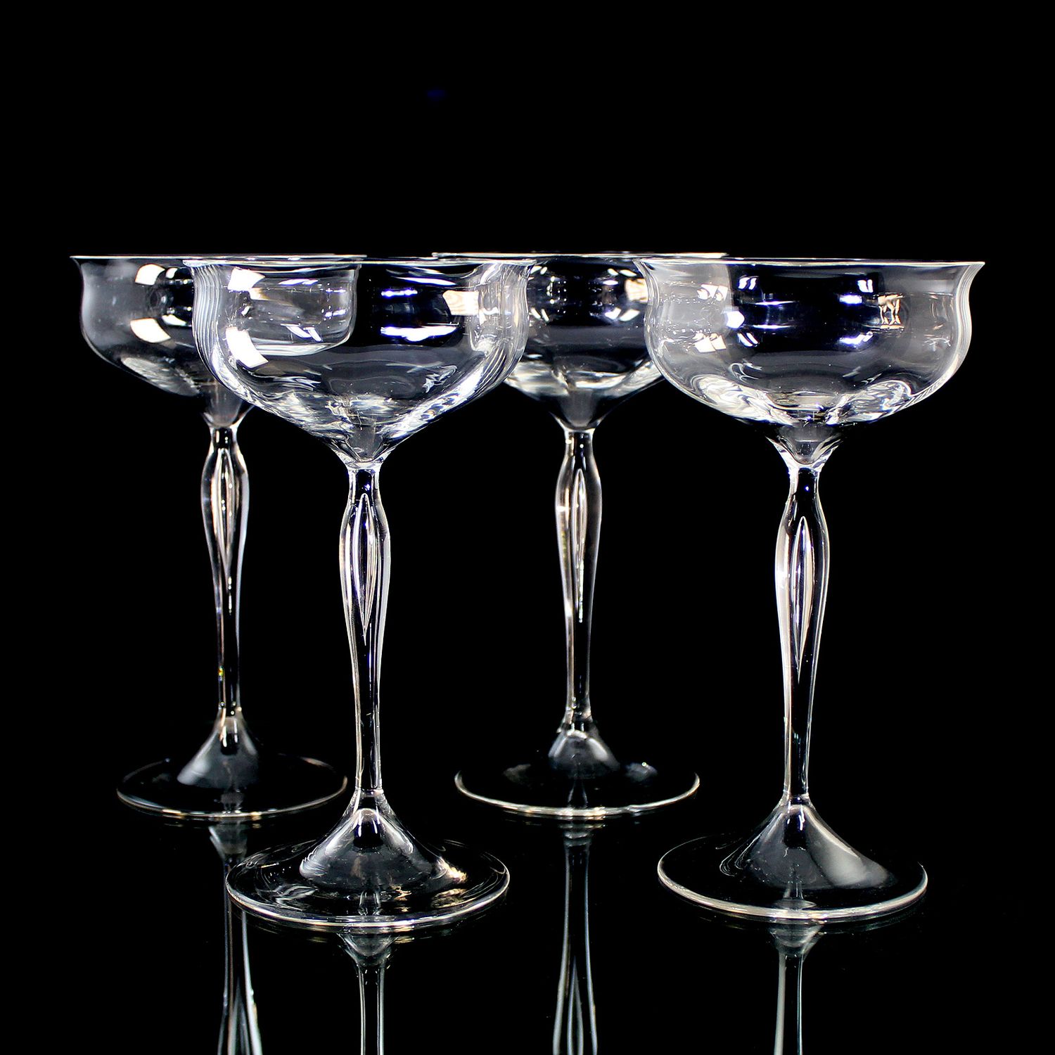 4 champagne glasses with optically ribbed bowls, Josephinenhütte, designed by Franz Pohl.