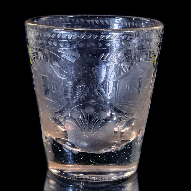 Thick-walled glass beaker featuring architecture, likely Potsdam, c. 1680–90.