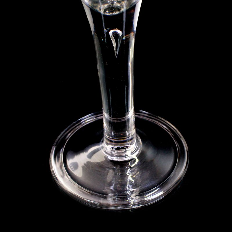 Pointed-bowl glass with folded rim and trapped air bubble, England, c. 1750.