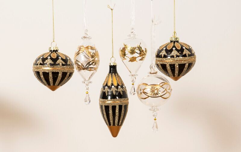 Rund ornament, skinnende sort, m. guld glimmer.