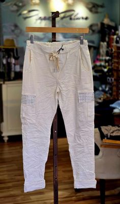 CU2410306987    CREAM CARGO STUDDED PANTS