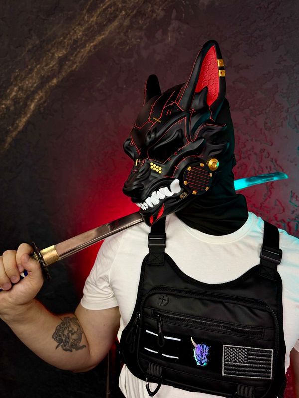 Black Cyberpunk Wolf mask with red lining and ears, gold accents and white fangs, full face kitsune design