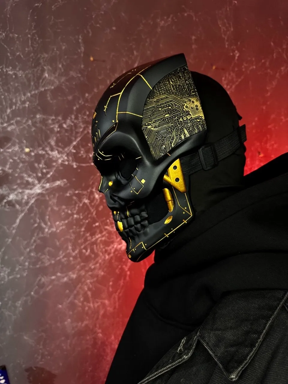 Black and gold cyberpunk skull mask with golden microcircuits, full face design