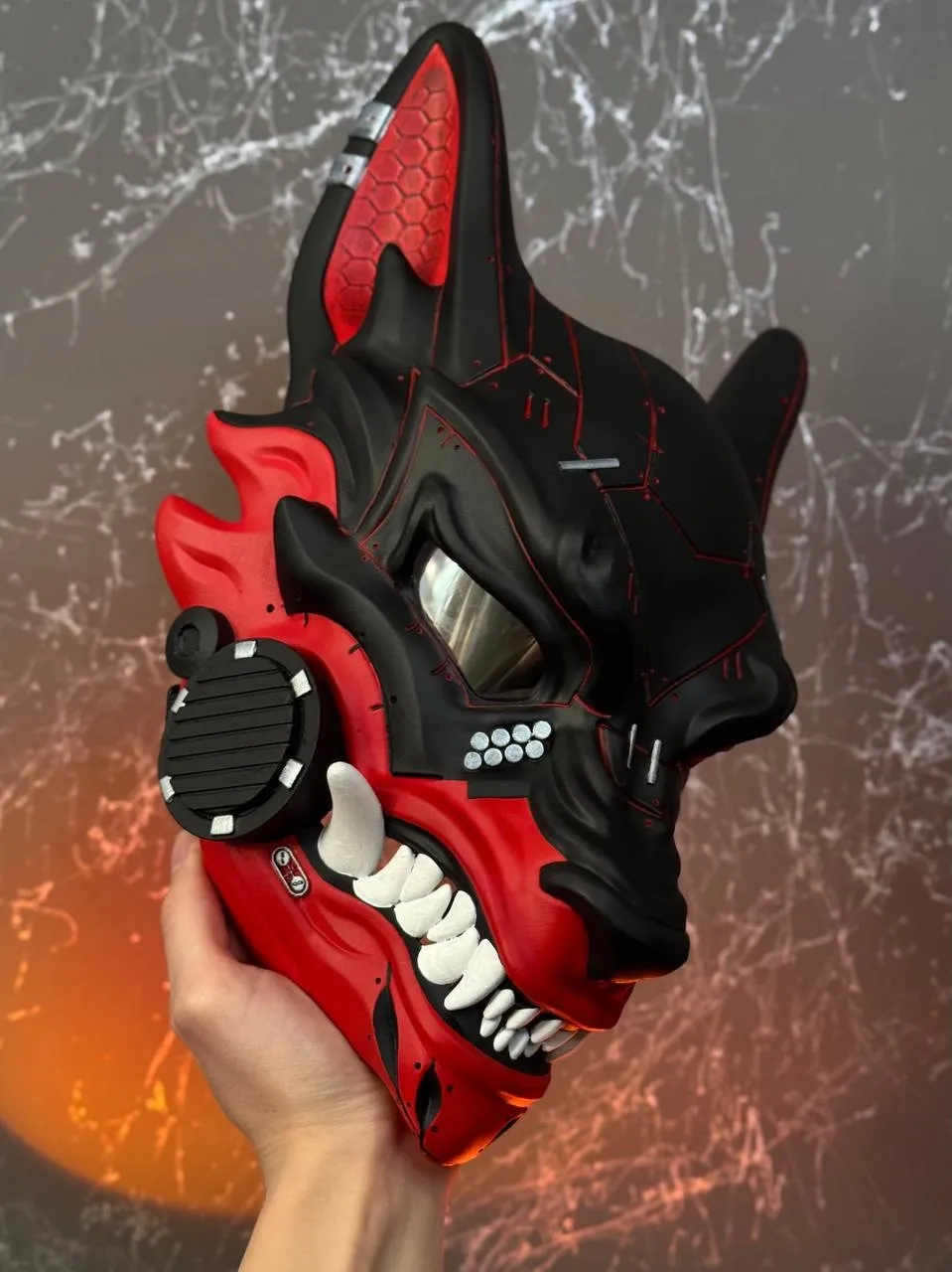 Half Black &amp; Half Red Cyberpunk Kitsune mask with silver accents and white fangs, full face wolf design