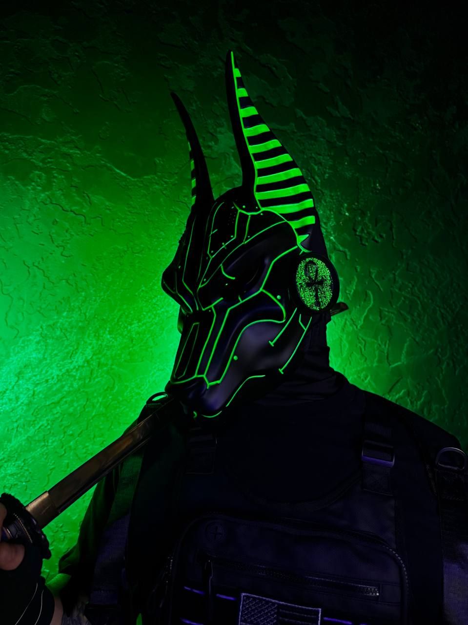 Black cyberpunk Anubis mask with green UV glow, full face jackal mask with adjustable straps, futuristic cosplay mask