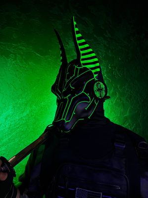 Black cyberpunk Anubis mask with green UV glow, full face jackal mask with adjustable straps, futuristic cosplay mask