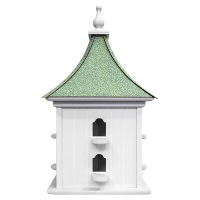Close-up of the Chestfield birdhouse showing the clean white finish of the body and the detailed green patina of the copper.