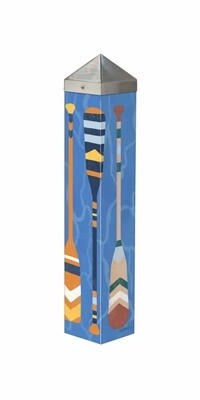 Angled view of the Paddles art pole design featuring geometric canoe oars on a sky blue background.