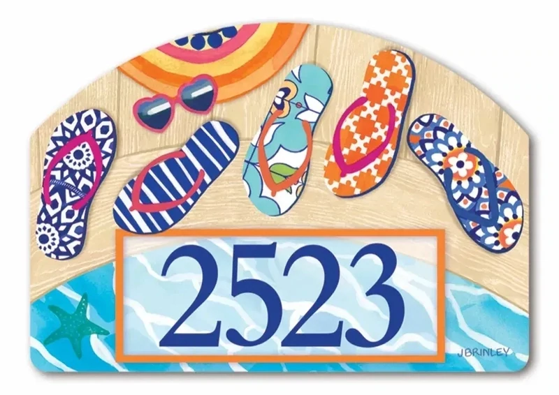 Close-up of a magnetic yard sign design showing bright patterned flip flops and address numbers.