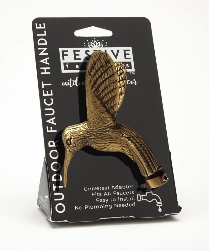 Decorative gold-tone hummingbird outdoor faucet handle with detailed wings and beak. Affixed to its packaging