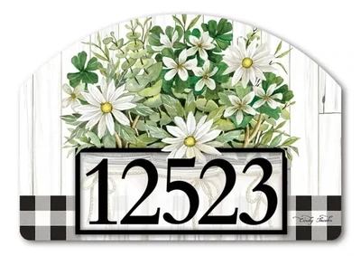 Close-up of magnetic yard sign featuring white daisies in a mason jar and adhesive address numbers.