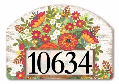 Close-up of a magnetic yard sign design showing autumn flowers, pumpkins, and adhesive address numbers.