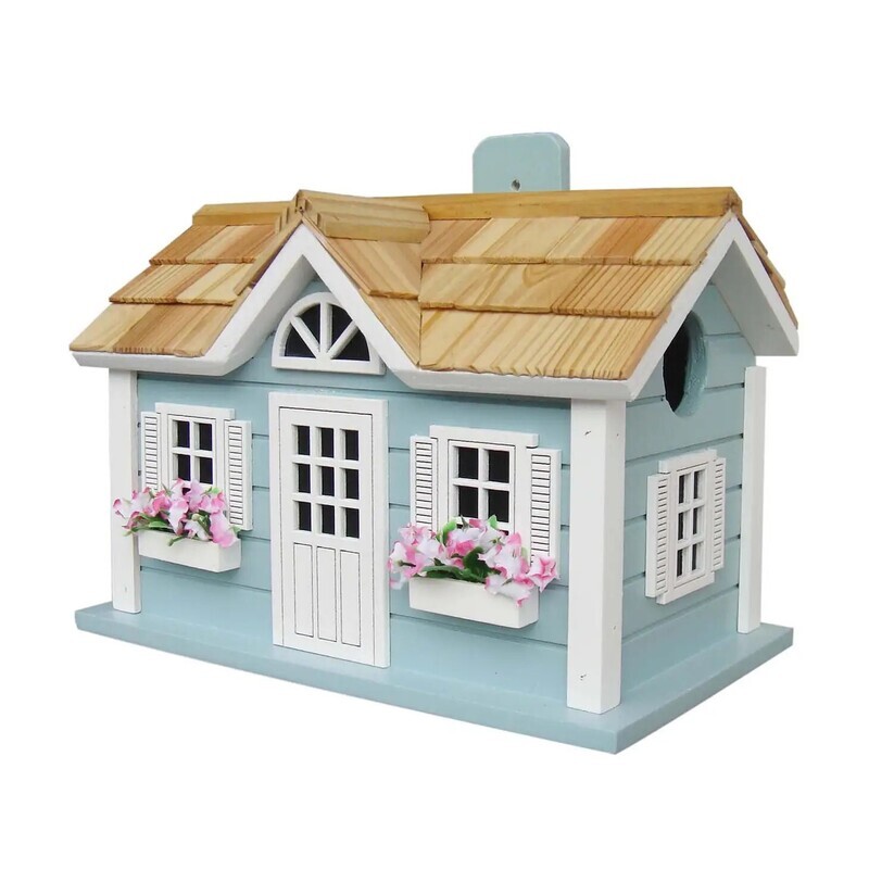 Front view of a light blue Nantucket cottage birdhouse with white trim and a shingled roof.