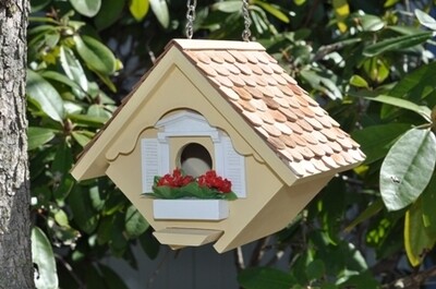 Side view of the Little Wren House showing the galvanized hanging chain and white trim accents.