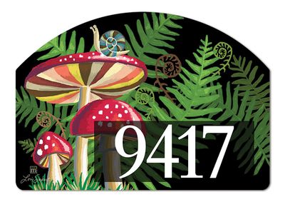 Close-up of a magnetic yard sign design showing a red mushroom, snails, green ferns, and adhesive address numbers.